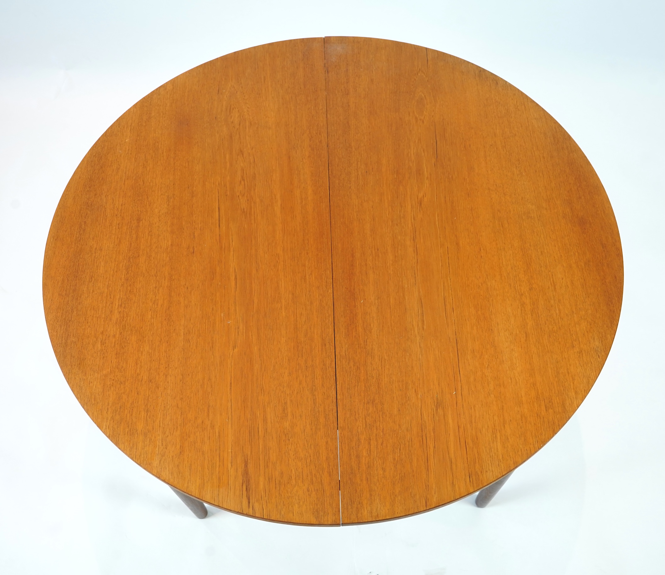 Hans Olsen (Danish, 1919–1992) for Frem Røjle: A Danish teak 'Roundette' extending dining table and six chairs